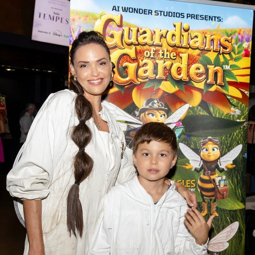 Carrie Diaz with her son, both wearing full beekeeper fear, and the movie premier of "Guardians of the Garden"
